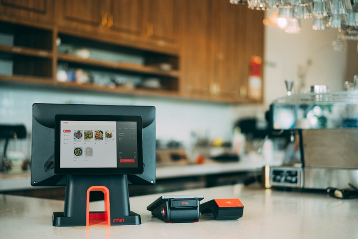 POS equipments displayed on a counter in a restaurant.